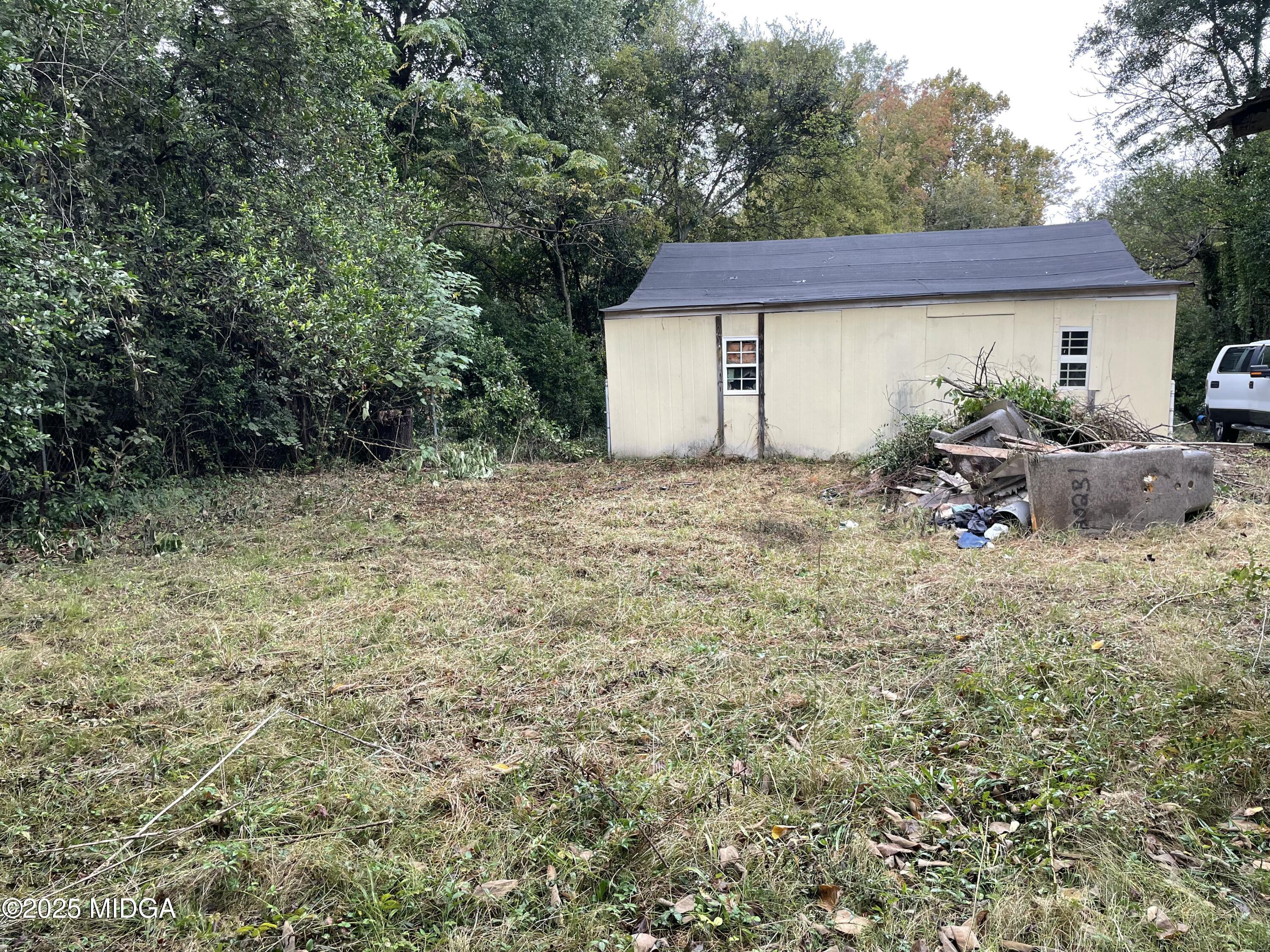 648 Hightower Road Macon, GA 31206 - Photo 19 of 21 a backyard of a house with table and chairs