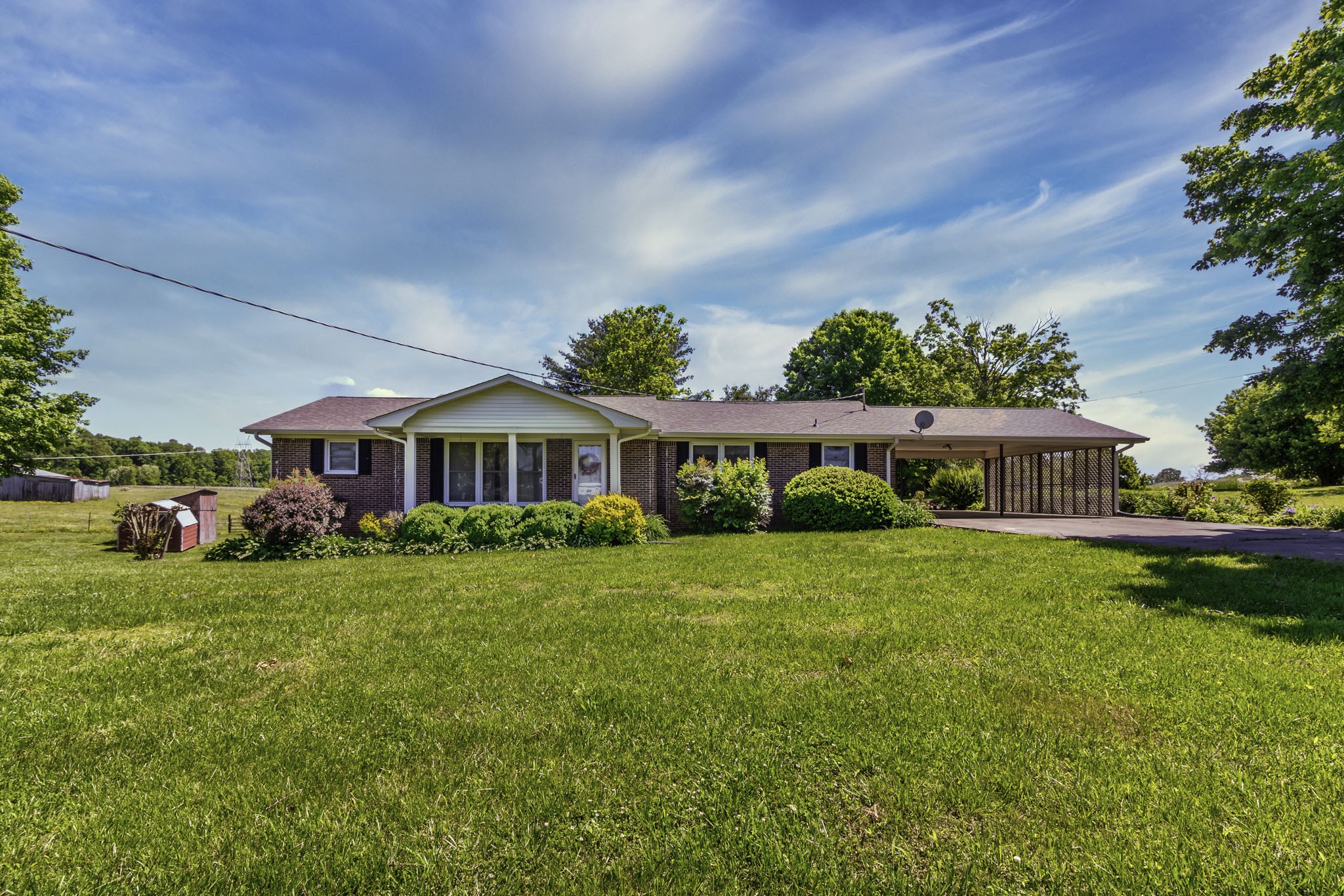 54 Purcell Road Leoma, TN 38468 - Photo 1 of 29 a front view of a house with a garden