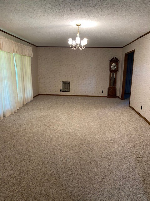 54 Purcell Road Leoma, TN 38468 - Photo 10 of 29 an empty room with a chandelier fan and a large window
