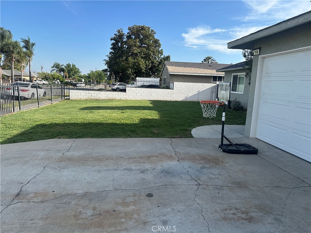 114 South Acacia Avenue Rialto, CA 92376 - Photo 16 of 21 a view of a house with a yard
