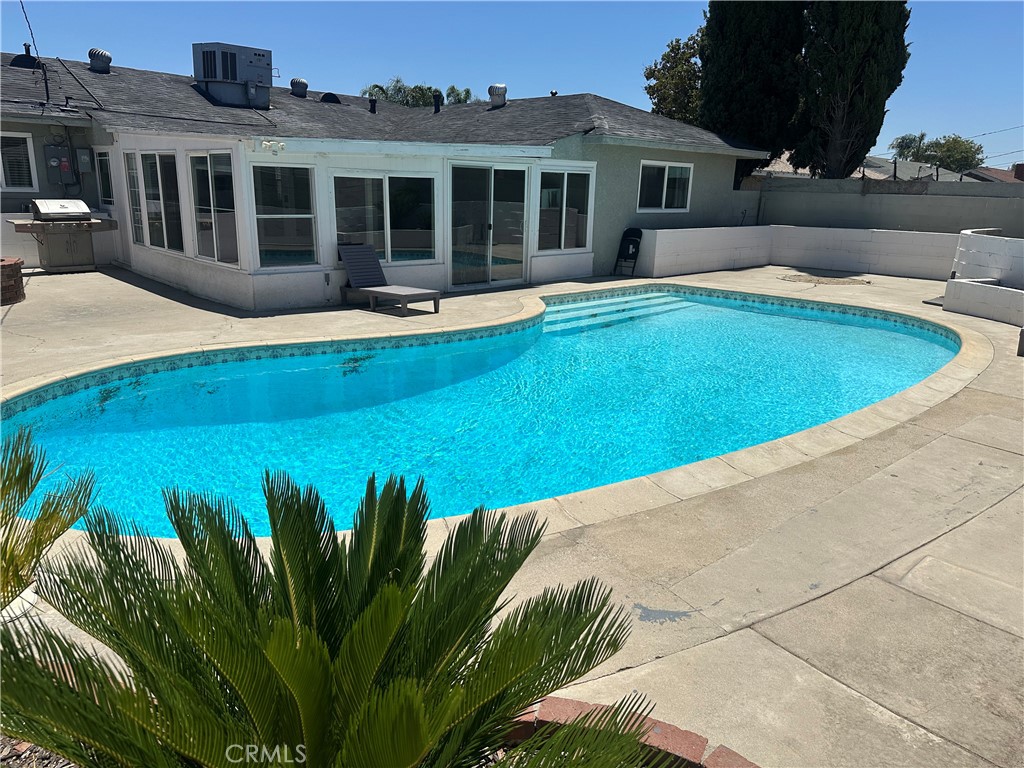 114 South Acacia Avenue Rialto, CA 92376 - Photo 19 of 21 a view of a house with pool