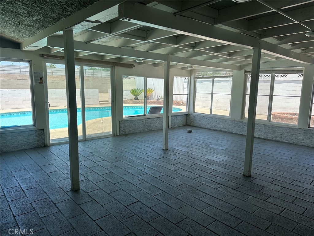 114 South Acacia Avenue Rialto, CA 92376 - Photo 6 of 21 a view of an empty room with glass door