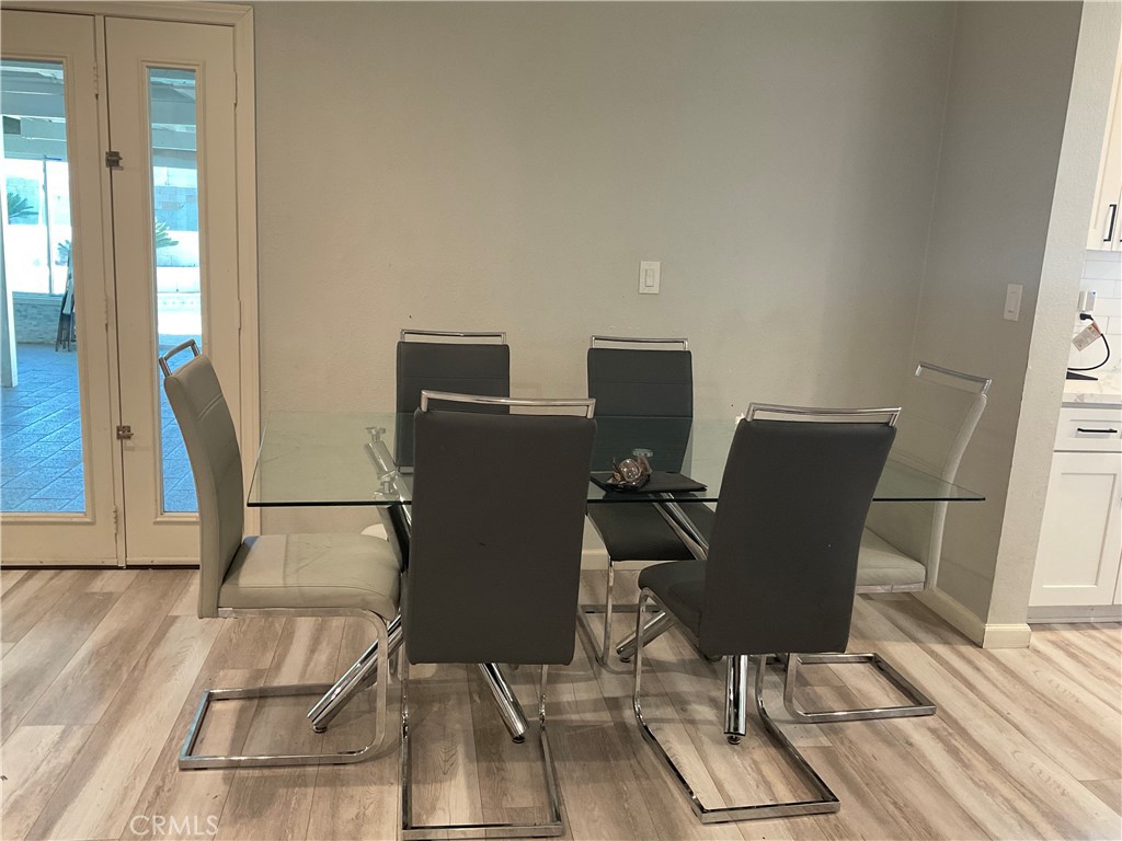 114 South Acacia Avenue Rialto, CA 92376 - Photo 7 of 21 a view of workspace with wooden floor windows