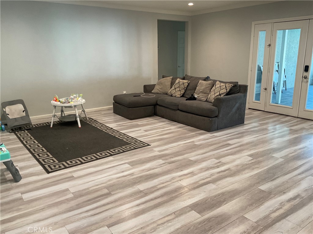 114 South Acacia Avenue Rialto, CA 92376 - Photo 8 of 21 a living room with furniture a rug and a table