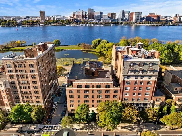 a view of a lake with tall buildings