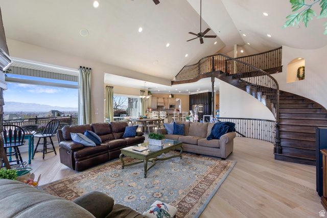 684 North Summit Way Alpine, UT 84004 - Photo 25 of 58 Living room with light wood-style floors, a mountain view, ceiling fan, recessed lighting, and vaulted ceiling
