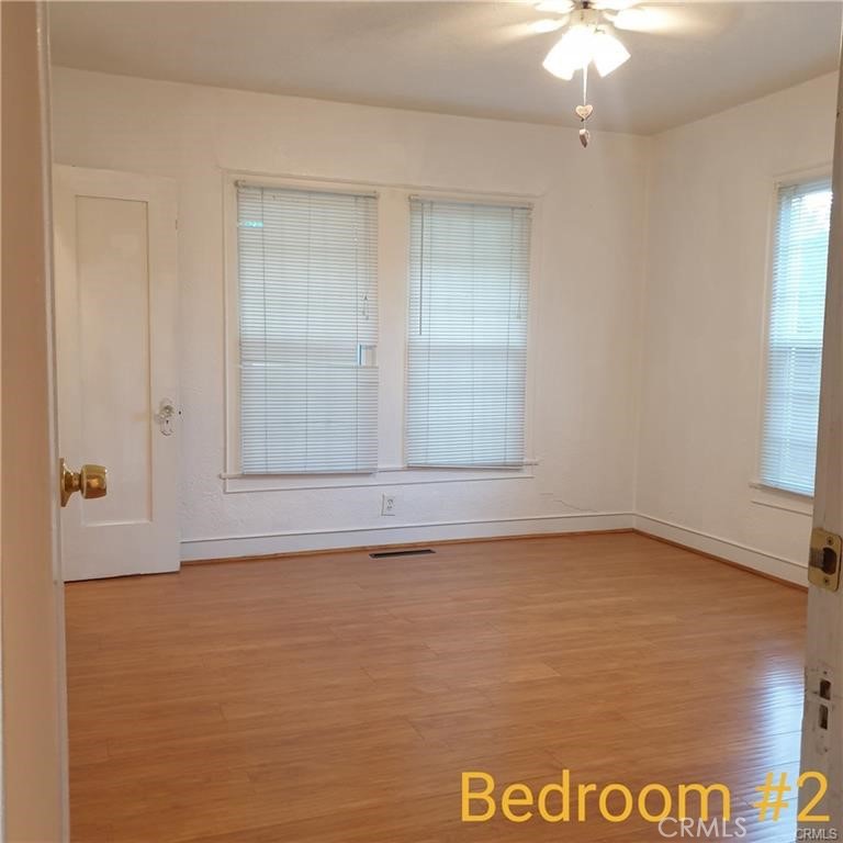 166 North Lemon Avenue Walnut, CA 91789 - Photo 11 of 16 an empty room with a ceiling fan