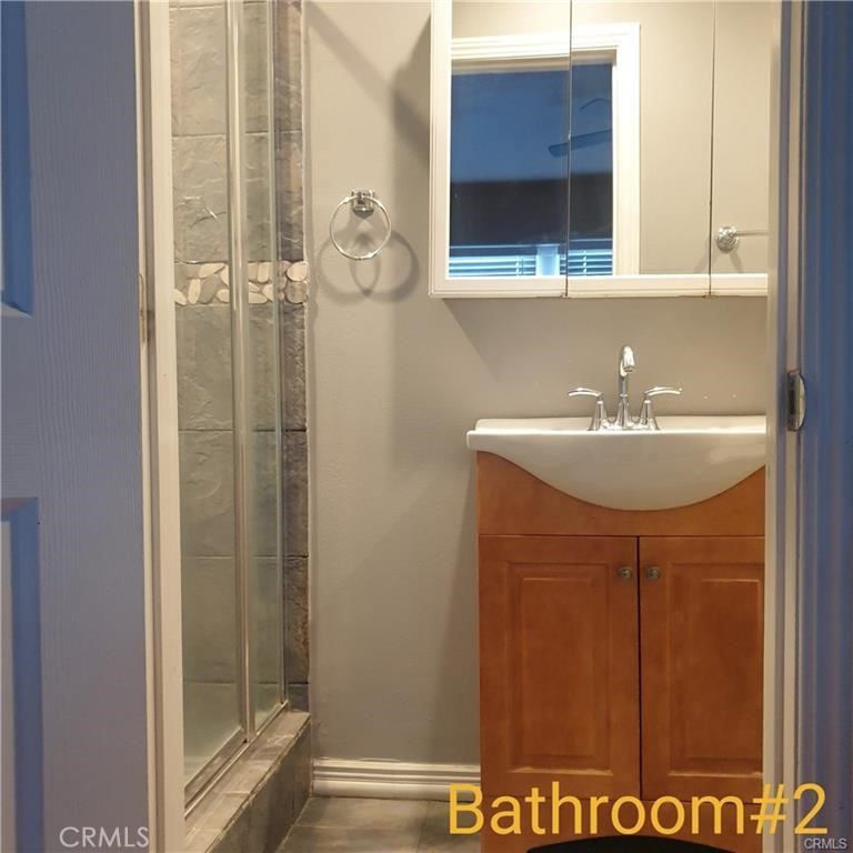166 North Lemon Avenue Walnut, CA 91789 - Photo 6 of 16 a bathroom with a sink and a mirror