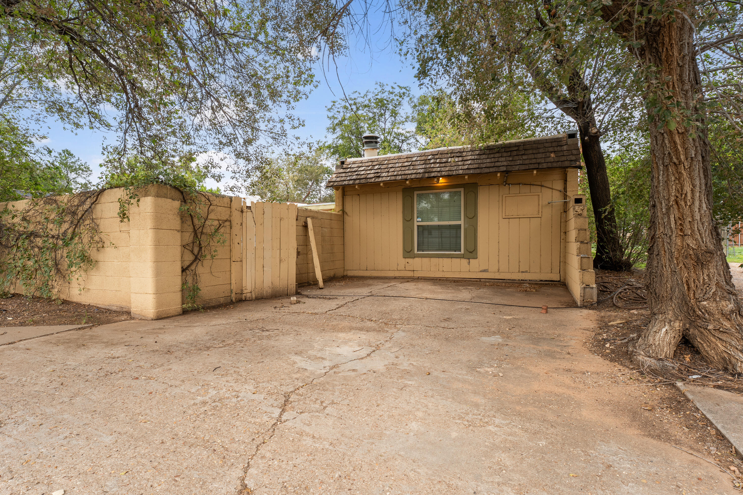 2702 23rd Street Lubbock, TX 79410 - Photo 20 of 30 a house with trees in the background