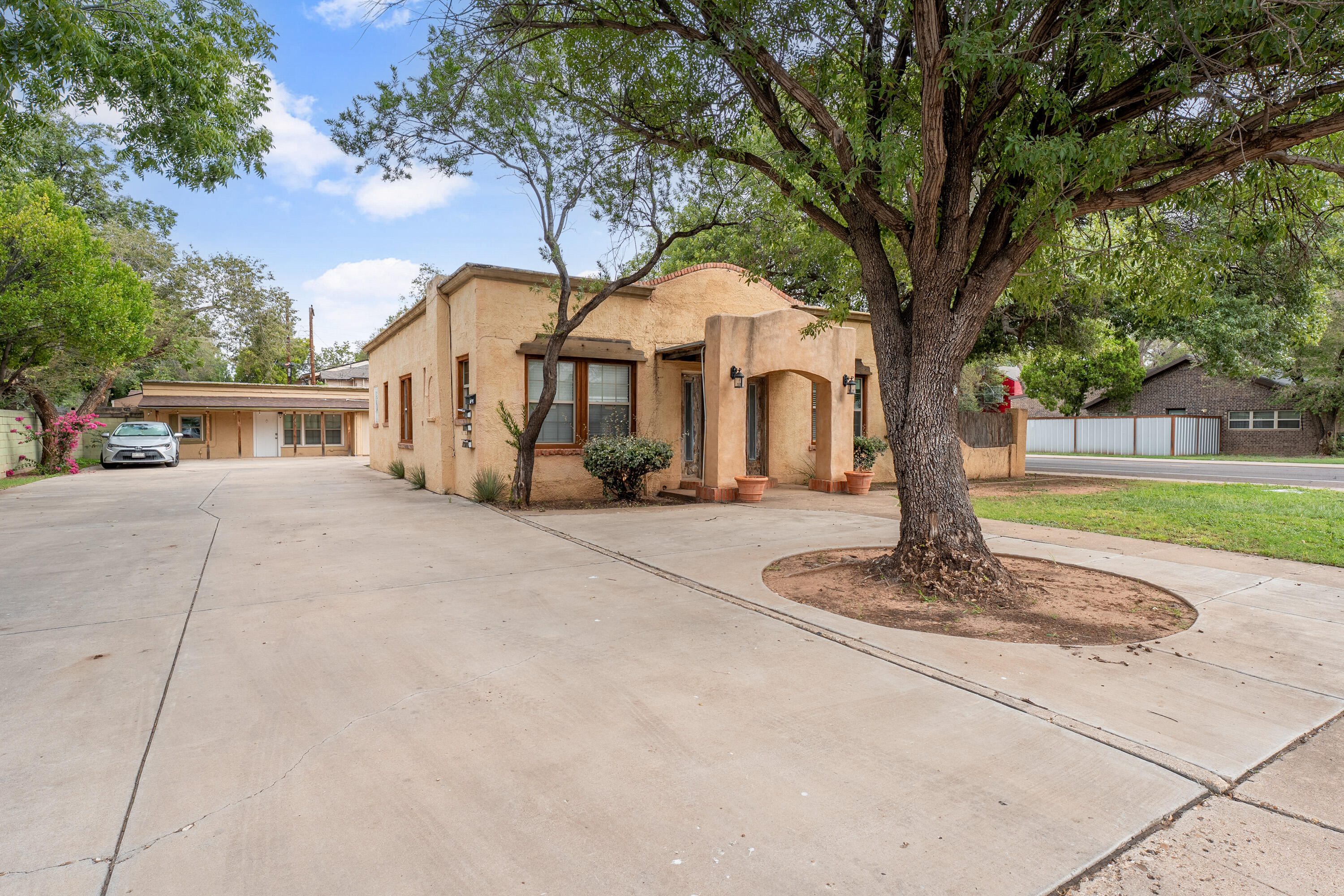 2702 23rd Street Lubbock, TX 79410 - Photo 2 of 30 a front view of a house with a garden