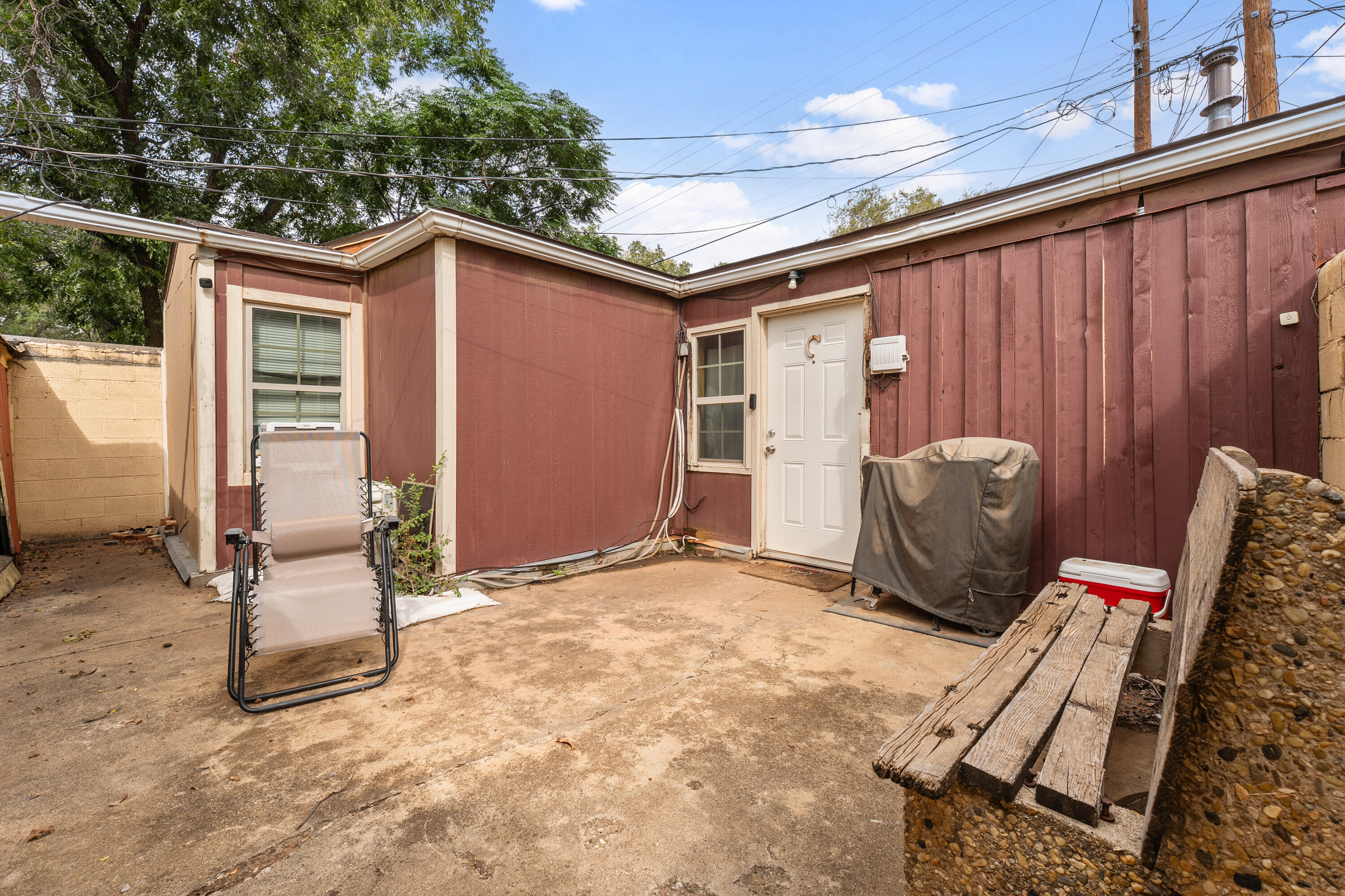 2702 23rd Street Lubbock, TX 79410 - Photo 21 of 30 a view of a backyard with furniture and a ceiling fan
