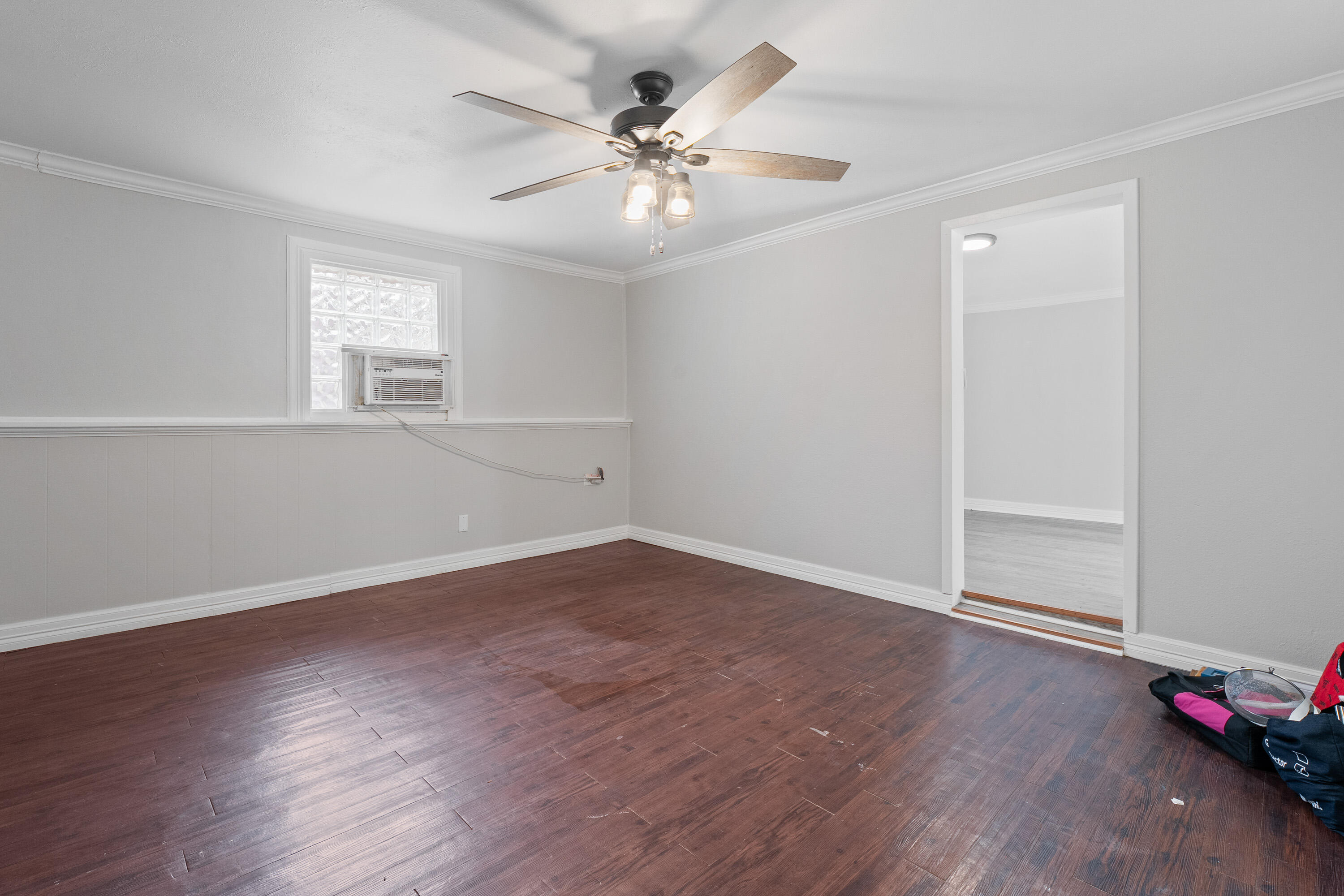 2702 23rd Street Lubbock, TX 79410 - Photo 26 of 30 an empty room with wooden floor and windows