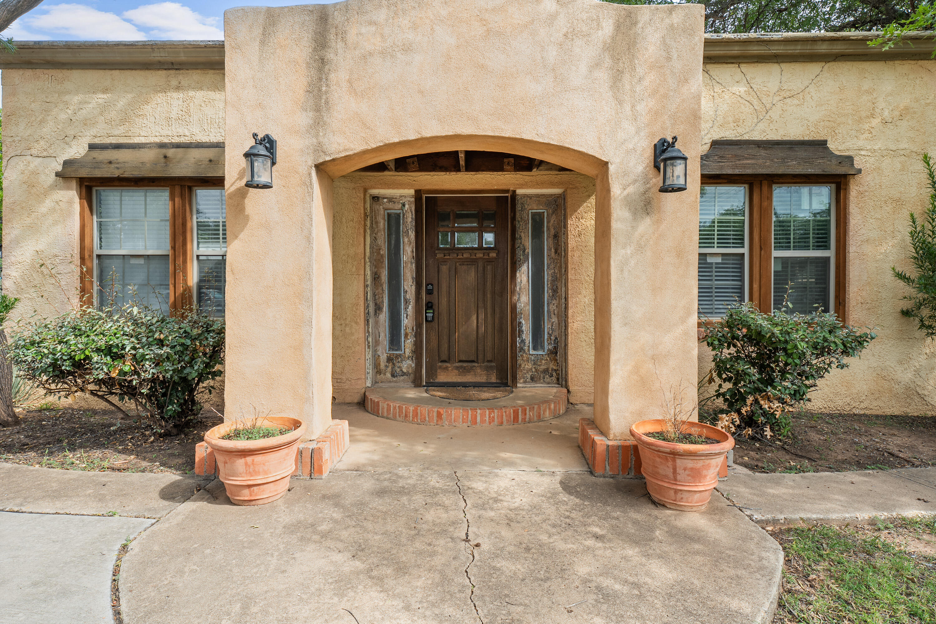 2702 23rd Street Lubbock, TX 79410 - Photo 3 of 30 a front view of a house with garden