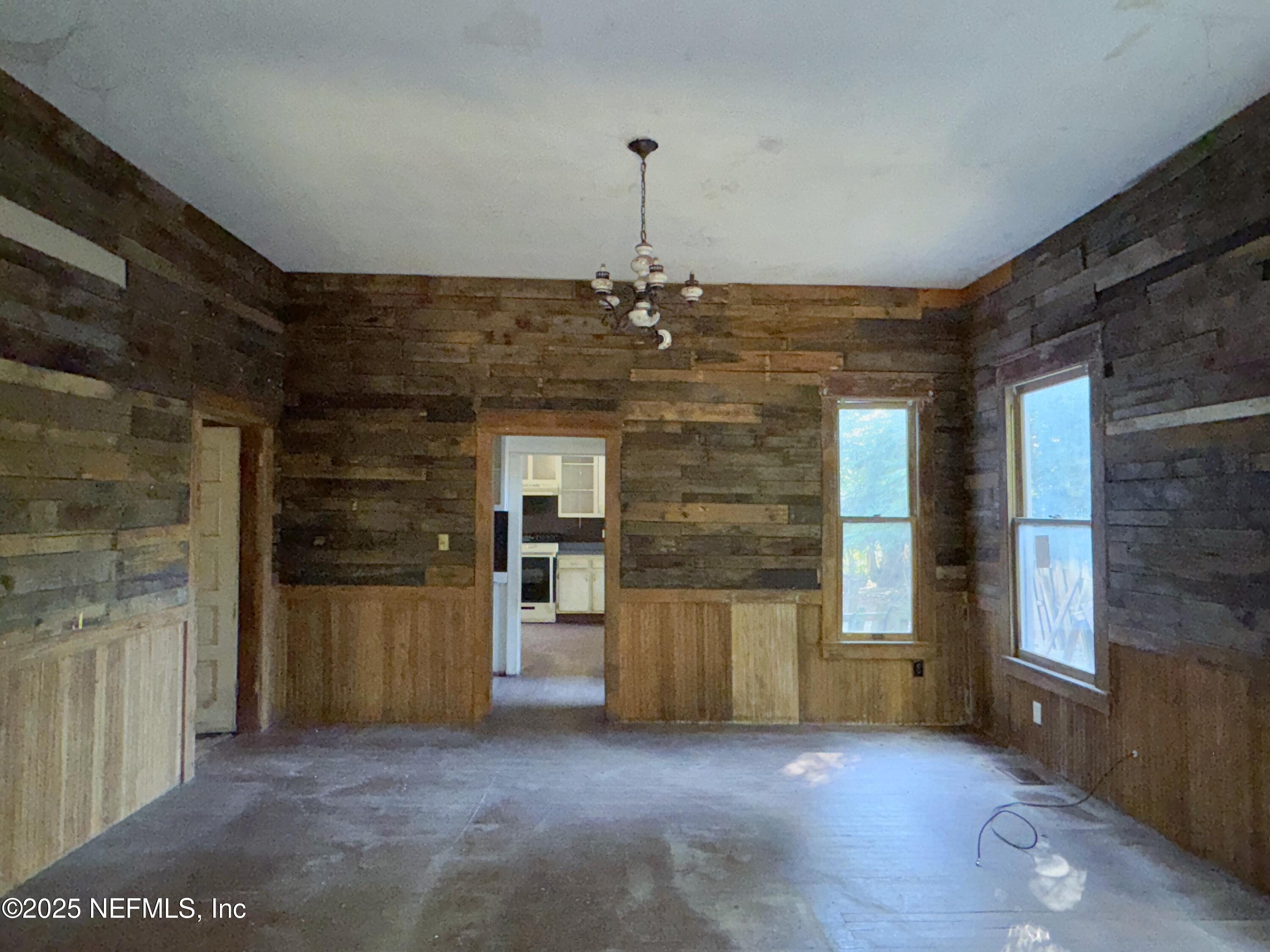 225 Lake George Road Seville, FL 32190 - Photo 14 of 37 a view of a hallway with a cabinet and a window
