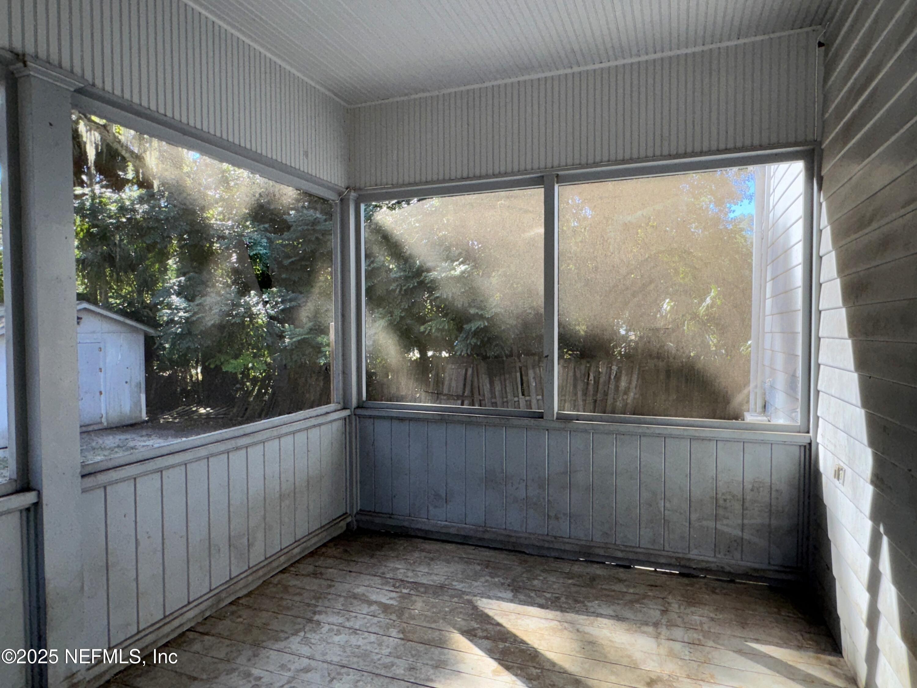 225 Lake George Road Seville, FL 32190 - Photo 19 of 37 a view of an empty room with a window