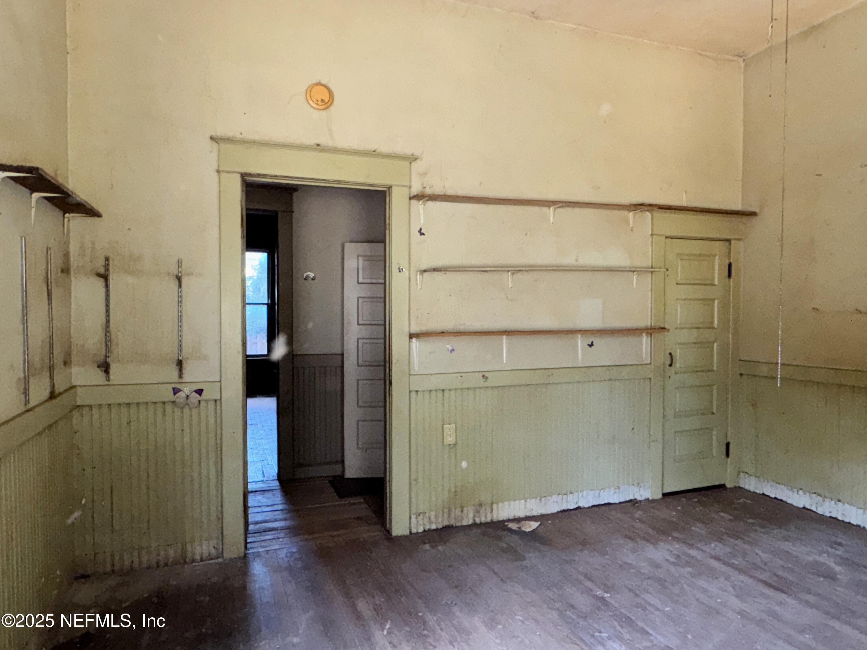 225 Lake George Road Seville, FL 32190 - Photo 21 of 37 an empty room with wooden floor