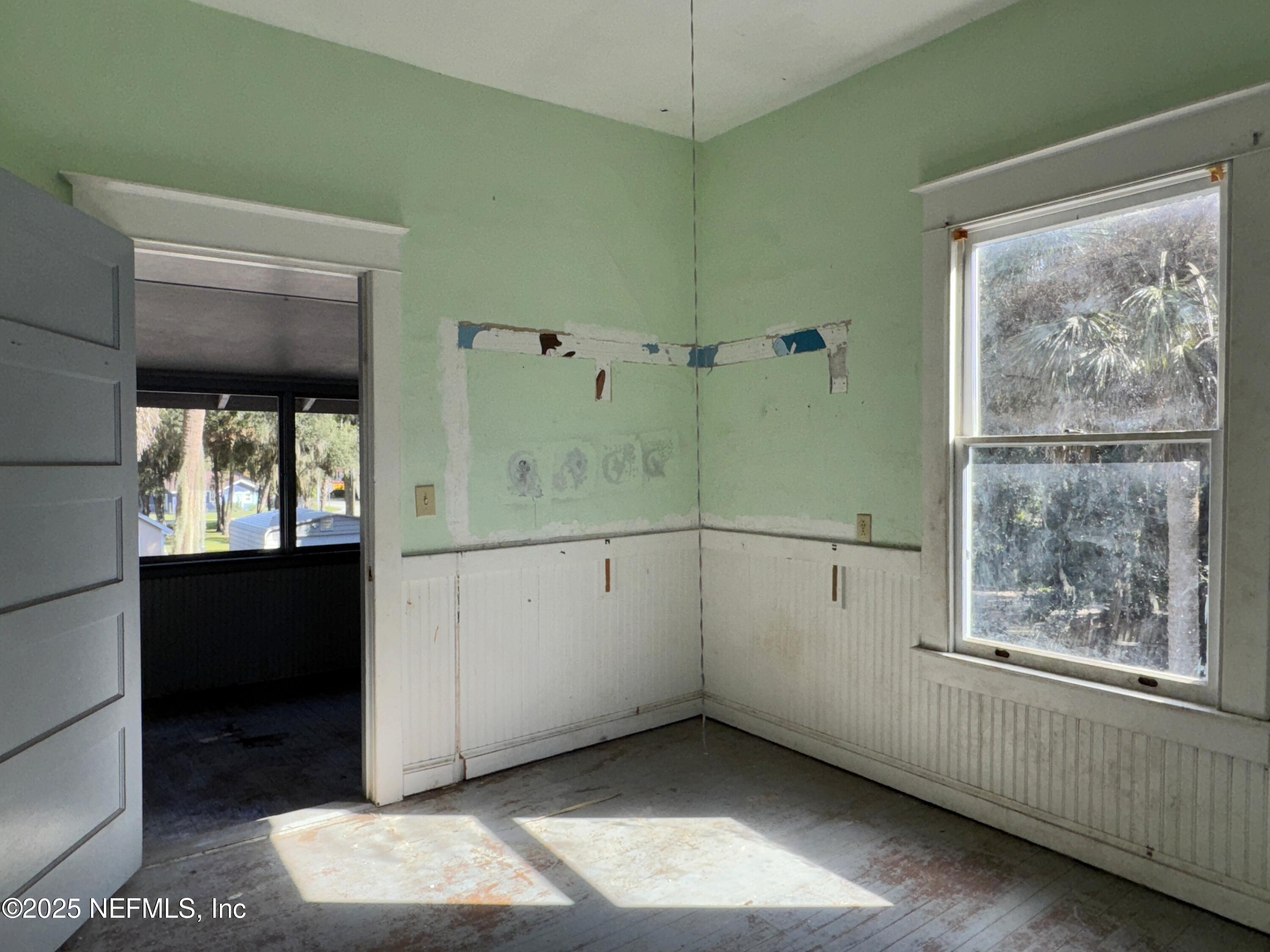 225 Lake George Road Seville, FL 32190 - Photo 27 of 37 a view of an empty room with a window