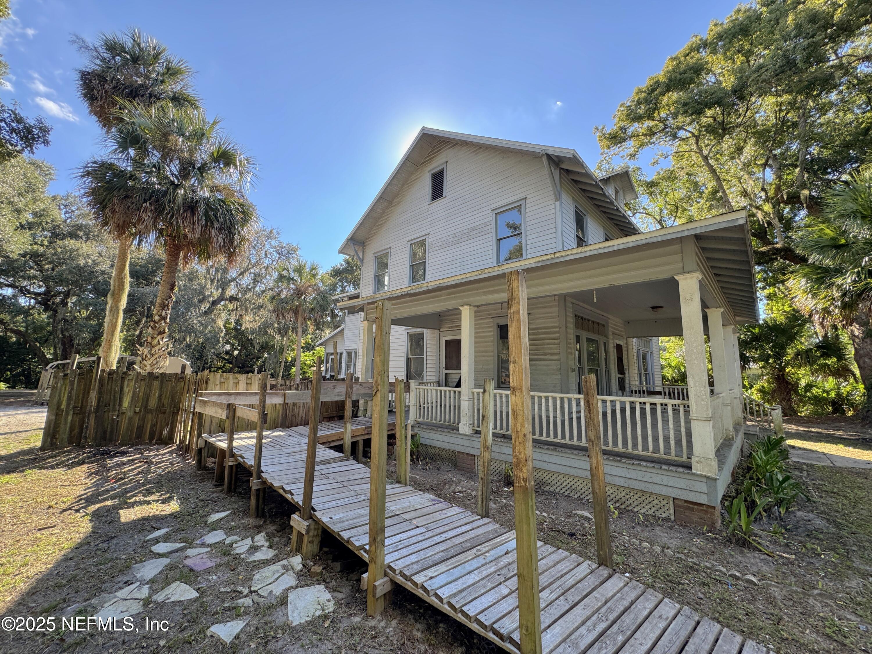 225 Lake George Road Seville, FL 32190 - Photo 3 of 37 a view of a house with a yard