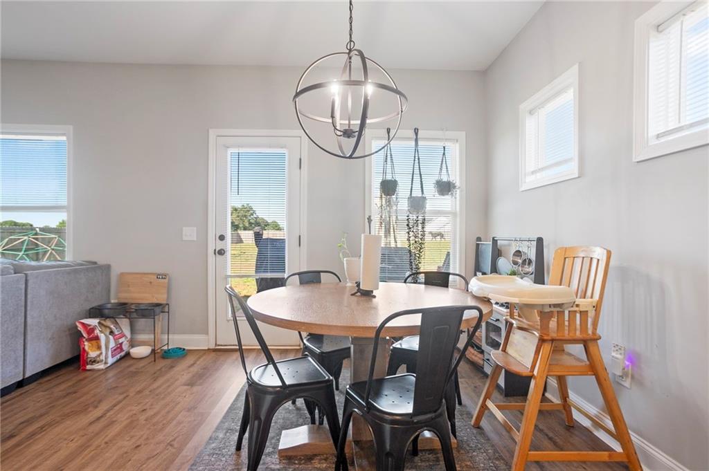 64 Neal Little Road Carnesville, GA 30521 - Photo 7 of 17 a view of a dining room with furniture window and wooden floor