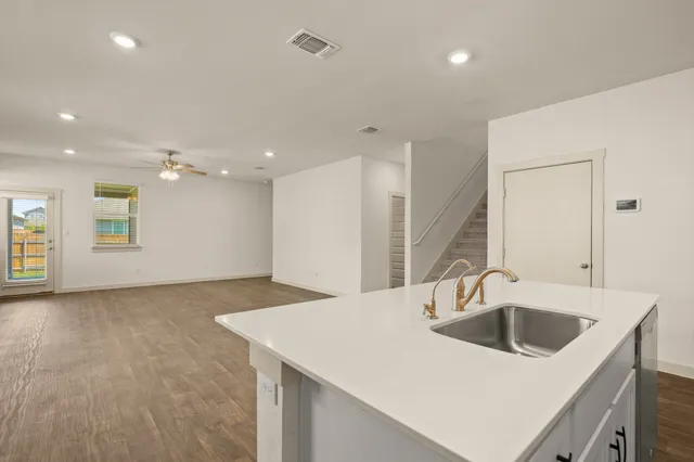 a kitchen with a sink a counter top space and a sink