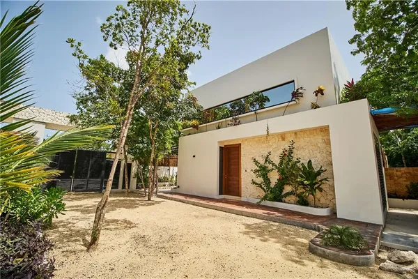 a view of a house with a tree