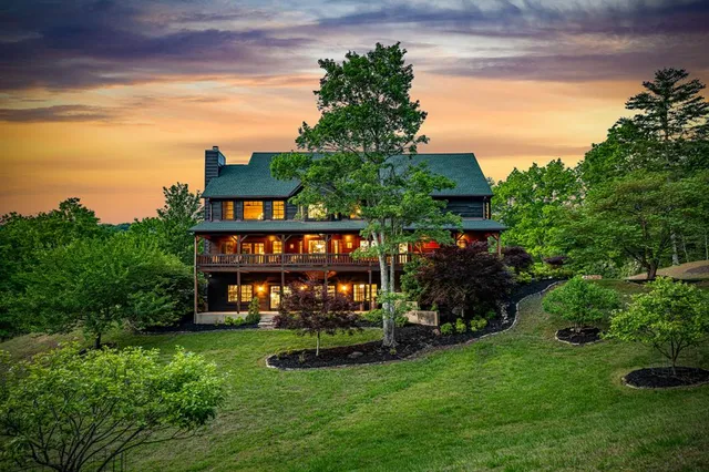 a view of a house with backyard porch and sitting area