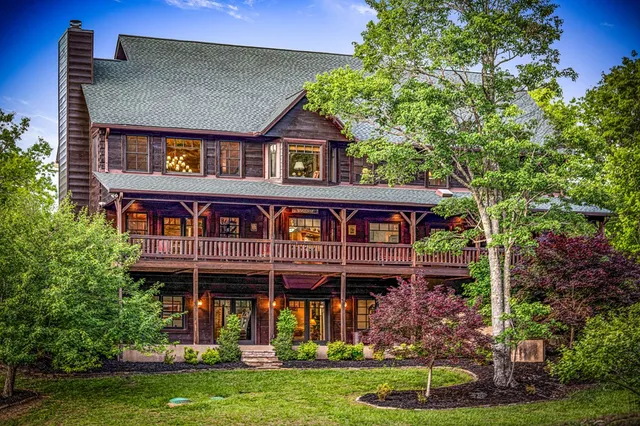 an aerial view of house with yard outdoor seating and green space
