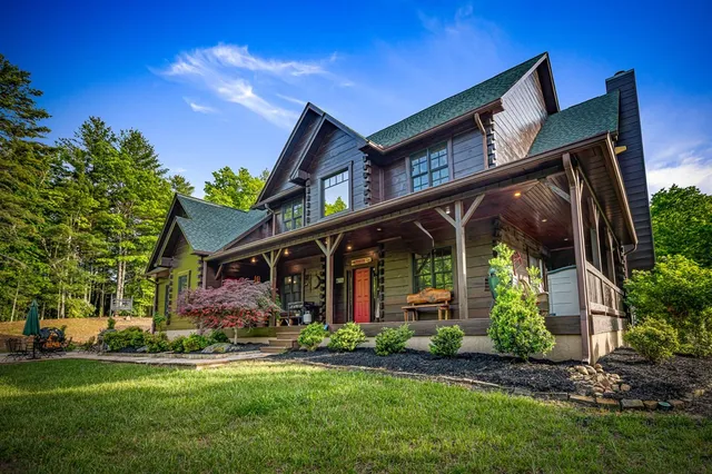 a bathroom with a sink mirror and toilet