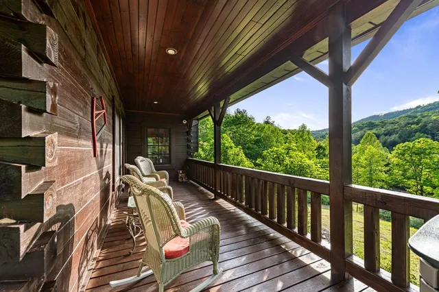 a view of a balcony with chairs
