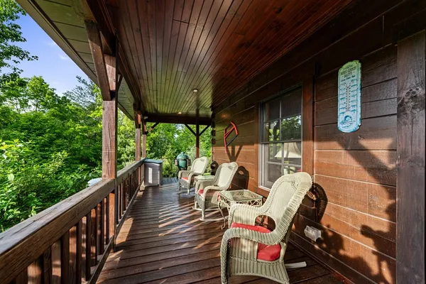 a view of a porch with wooden floor