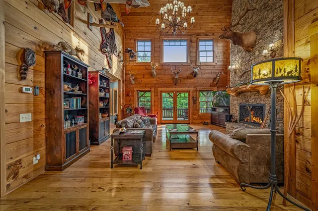 a living room with hard wood flooring and furniture