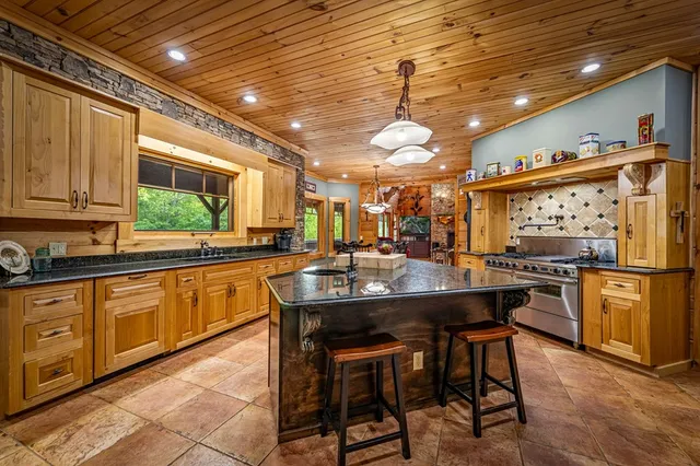 a view of a green field with lots of bushes