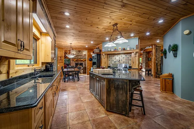 a view of a green field with lots of bushes