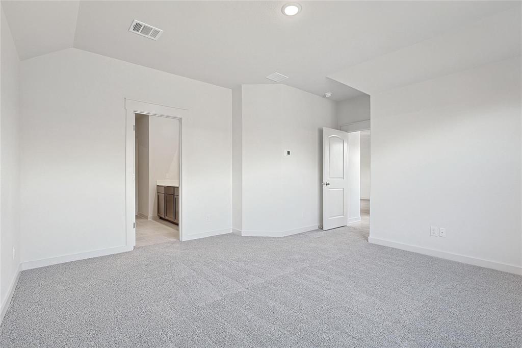 1759 Gleasondale Place Forney, TX 75126 - Photo 12 of 25 Unfurnished bedroom featuring light colored carpet, connected bathroom, and recessed lighting