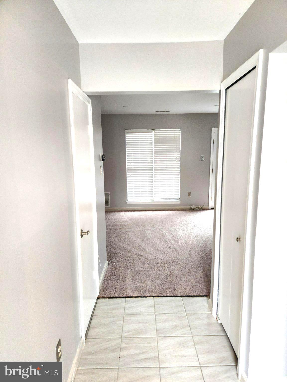 2384 Mitchellville Road Bowie, MD 20716 - Photo 11 of 44 Inviting hallway to bright living space.