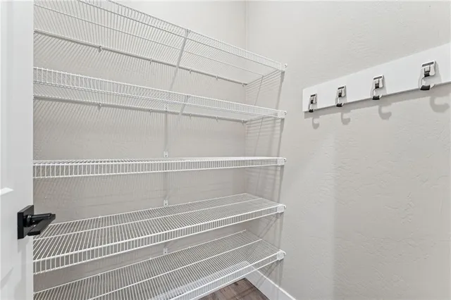 a view of a room with racks on the wall