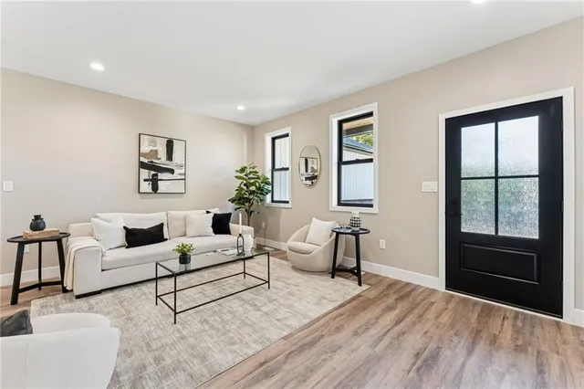 a living room with furniture and a window