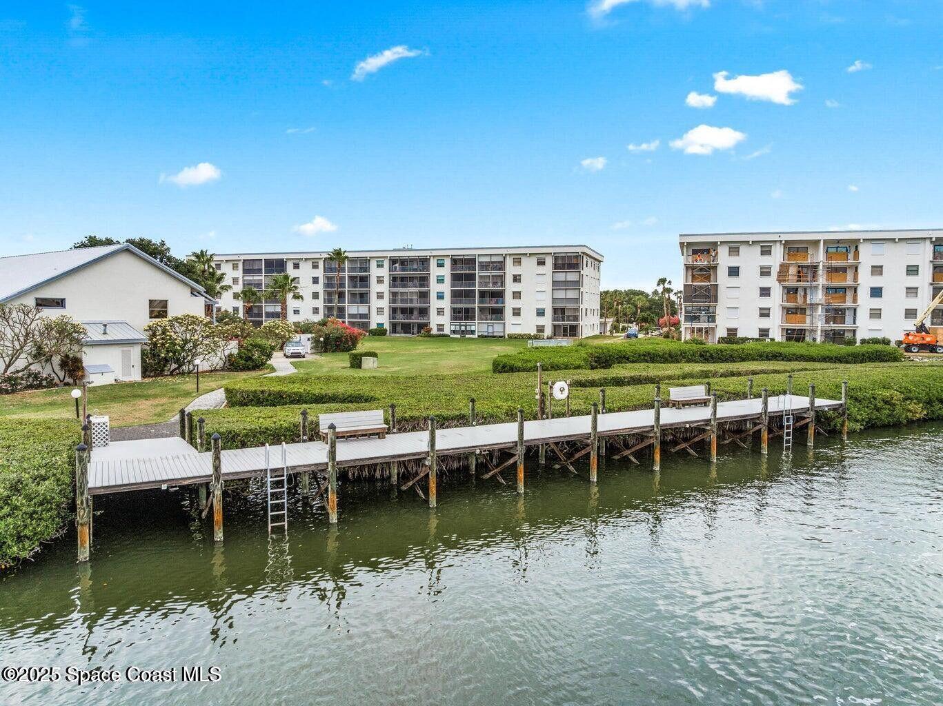 3165 North Atlantic Avenue, Unit C105 Cocoa Beach, FL 32931 - Photo 7 of 10 a view of a lake with a house swimming pool and outdoor space