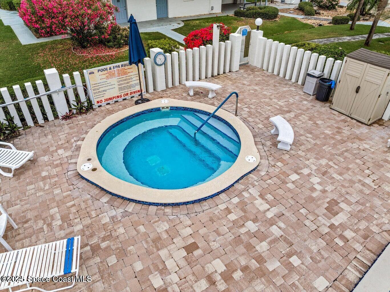 3165 North Atlantic Avenue, Unit C105 Cocoa Beach, FL 32931 - Photo 9 of 10 a view of outdoor space with deck and patio