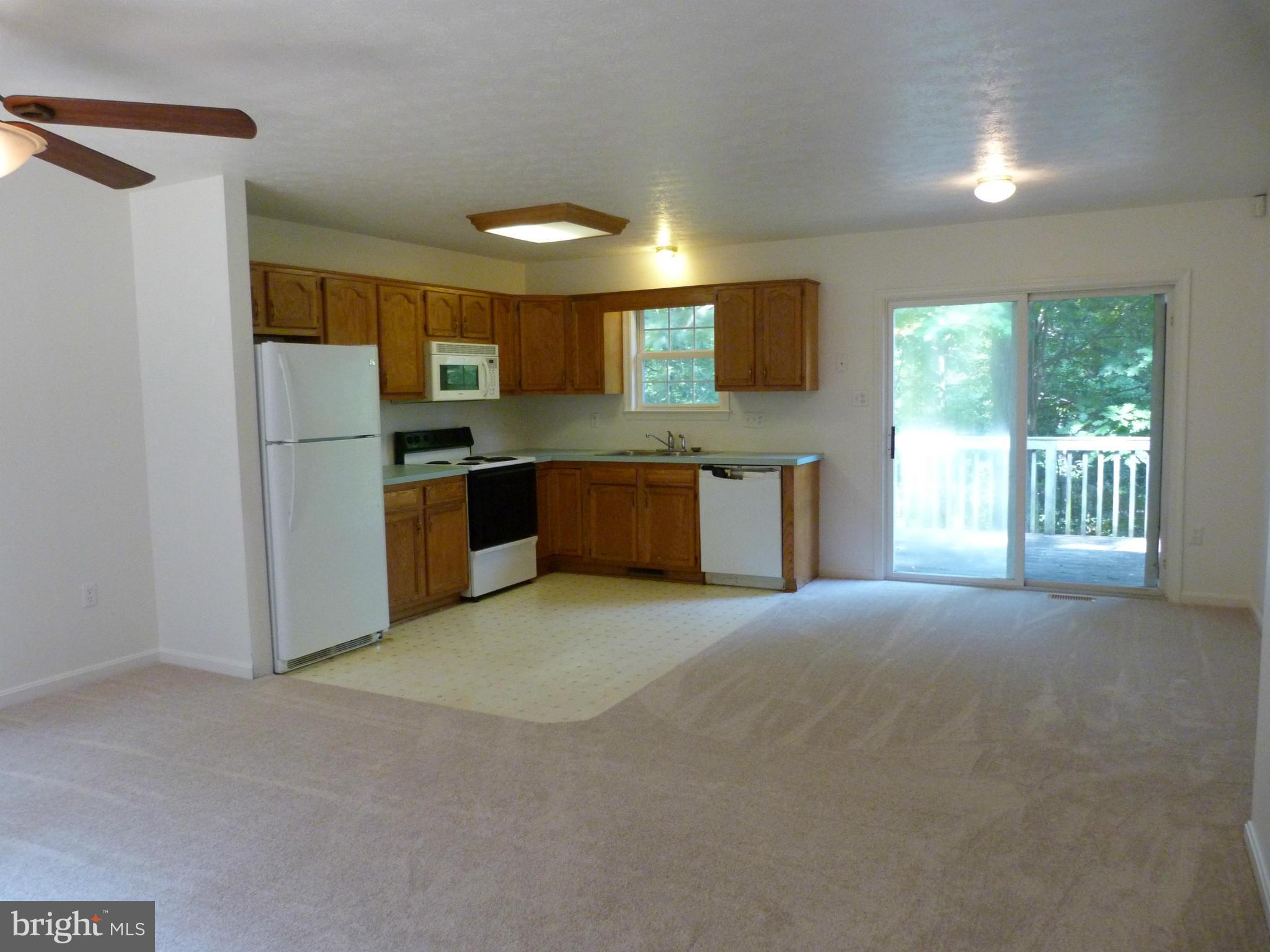 235 Freeze Road Linden, VA 22642 - Photo 2 of 10 a large kitchen with stainless steel appliances granite countertop a stove a sink and a refrigerator