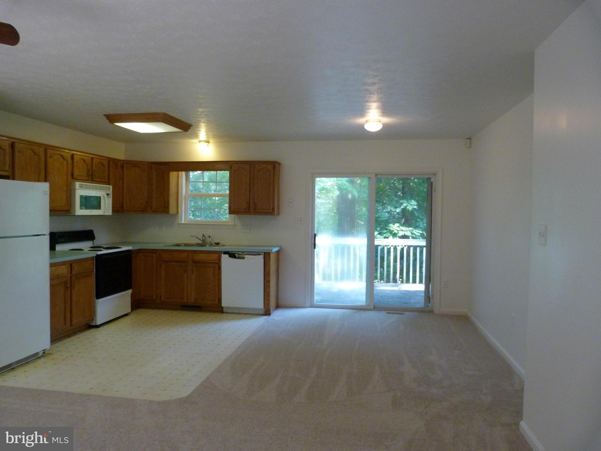235 Freeze Road Linden, VA 22642 - Photo 4 of 10 a kitchen with stainless steel appliances granite countertop a stove a sink and a refrigerator