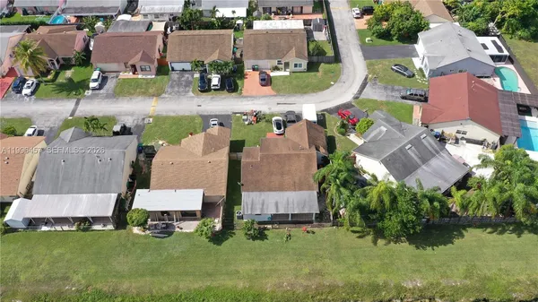 an aerial view of a house with lake view