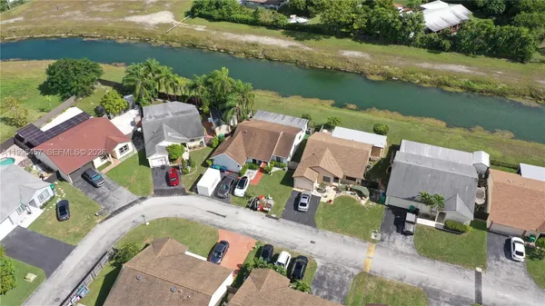 an aerial view of a house with a lake view