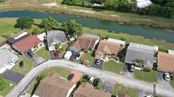 an aerial view of a swimming pool with outdoor space