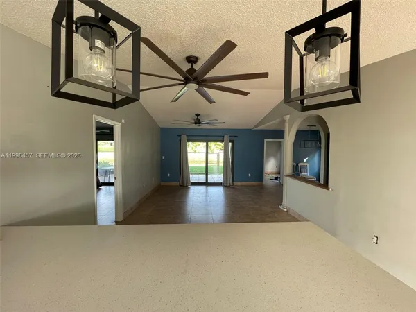 wooden floor in a hall with a window