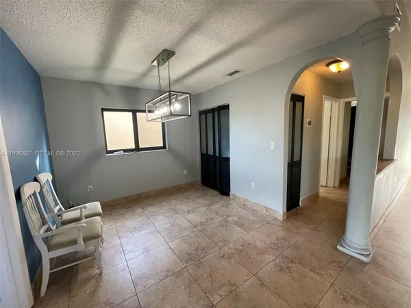 a view of a livingroom with furniture and windows