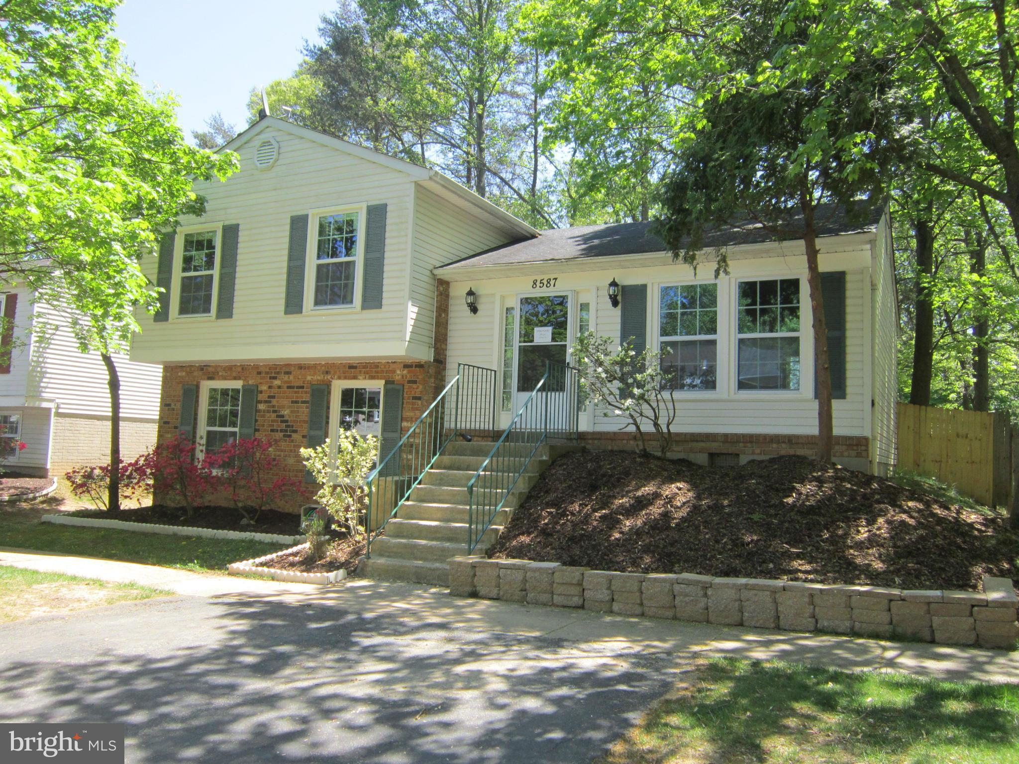 a front view of a house with garage