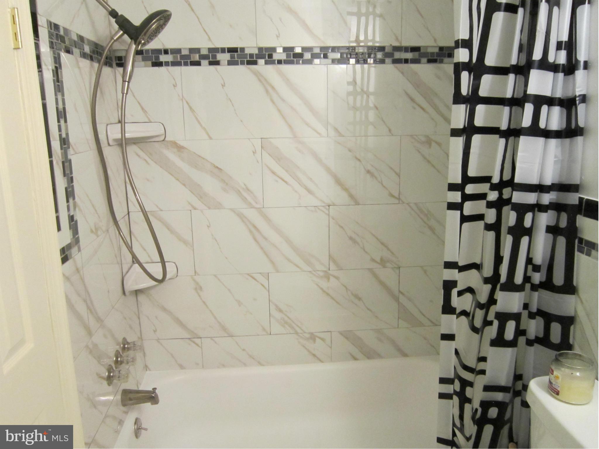 8587 Tyrolean Way Springfield, VA 22153 - Photo 12 of 30 a bathroom with a shower