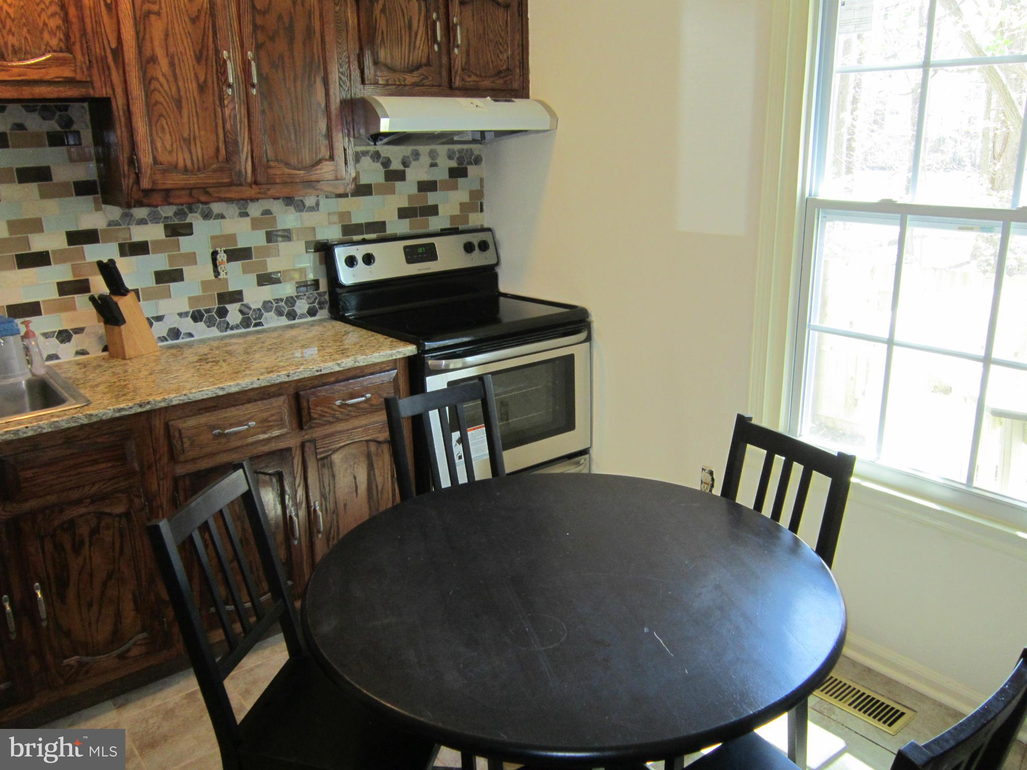 8587 Tyrolean Way Springfield, VA 22153 - Photo 17 of 30 a view of a kitchen counter space and a window