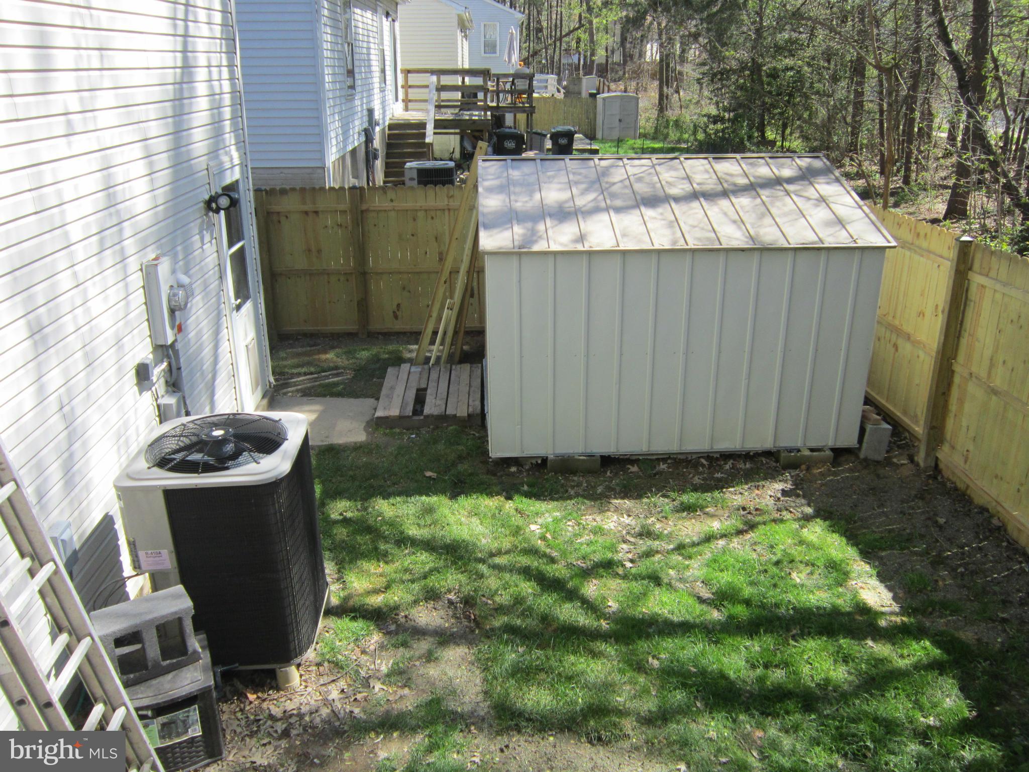 8587 Tyrolean Way Springfield, VA 22153 - Photo 27 of 30 a view of a backyard with plants and outdoor seating